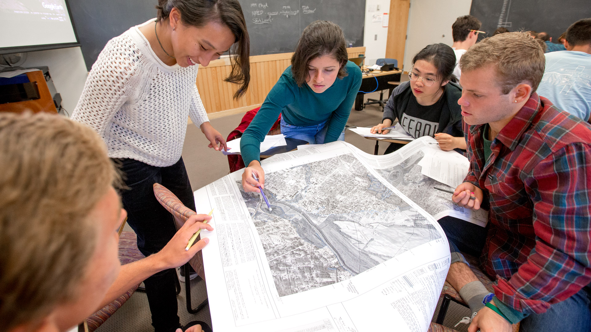Students work in a small group on a geology topo map.