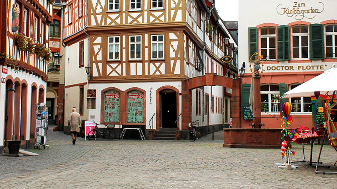 Town square in Germany, man walking
