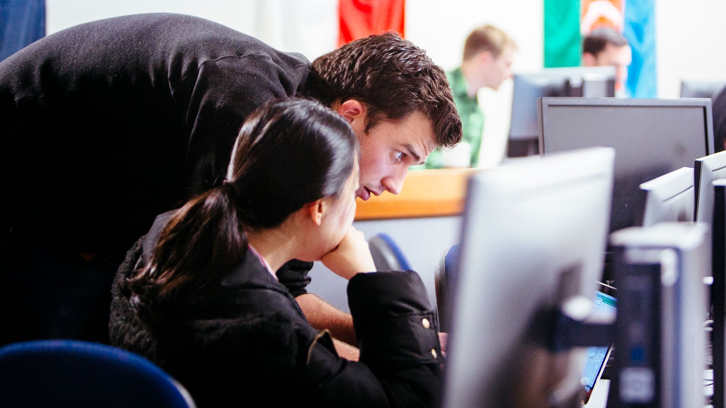 Students working together at a computer.