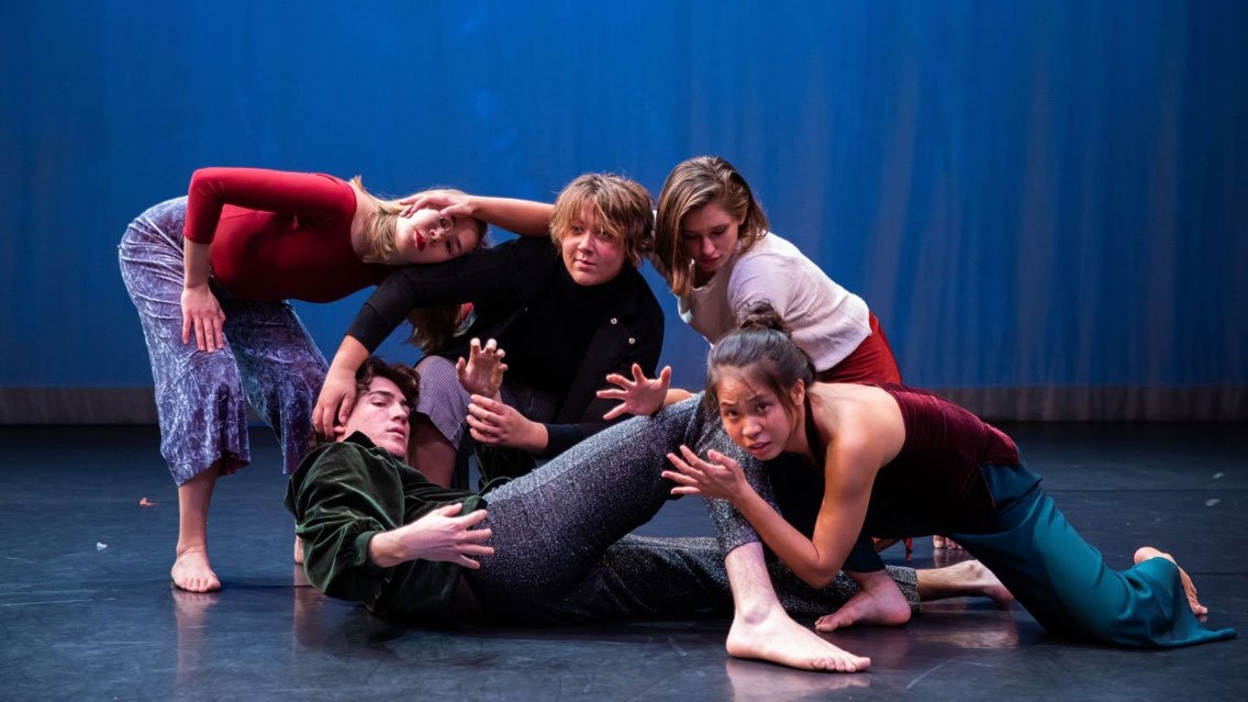 Students posing in a shape