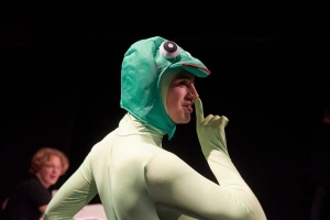 A student in a frog's costume