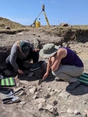 Paige Osgood '23 excavating at the Vasagård site, Bornholm island, Denmark. Vasagård consists of megalithic tombs, dolmens, and passage graves dated to c. 3500 BC.
