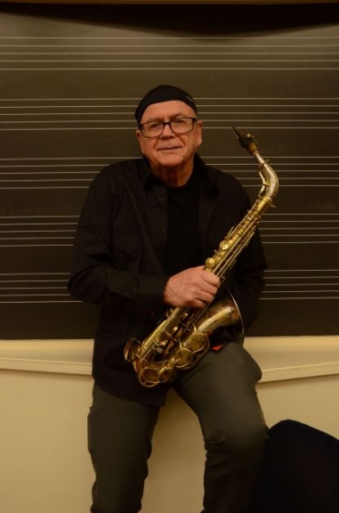 man holding a saxophone