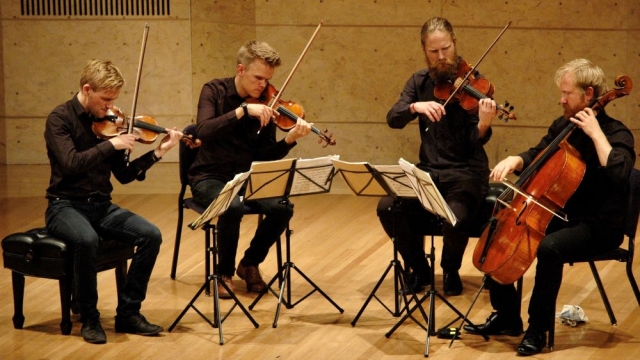 Danish Quartet performing stringed instruments on Robison Hall stage