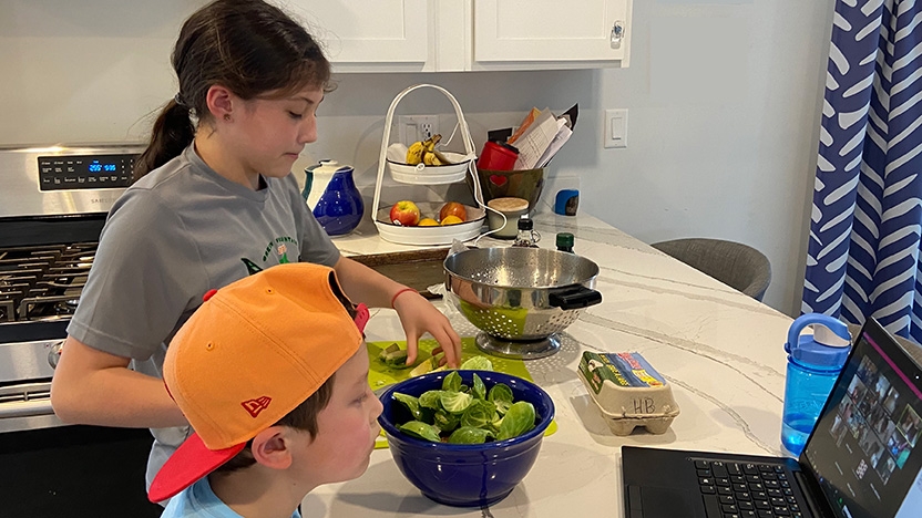 Two students from Mary Hogan elementary prepare a healthy meal.