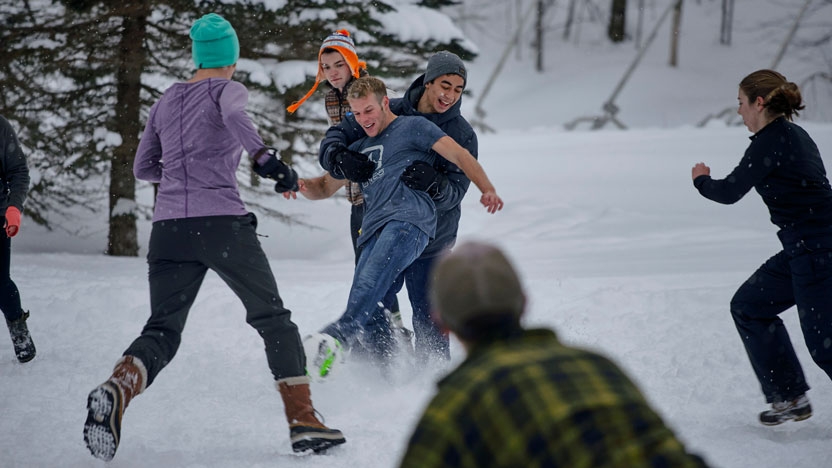 Students playing snow soccer as part of Middlebury Outdoor Programs.