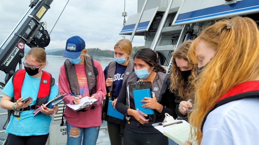 Students work on the Folger research vessel on Lake Champlain.