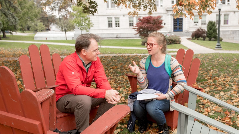 Professor works with a first-year student.