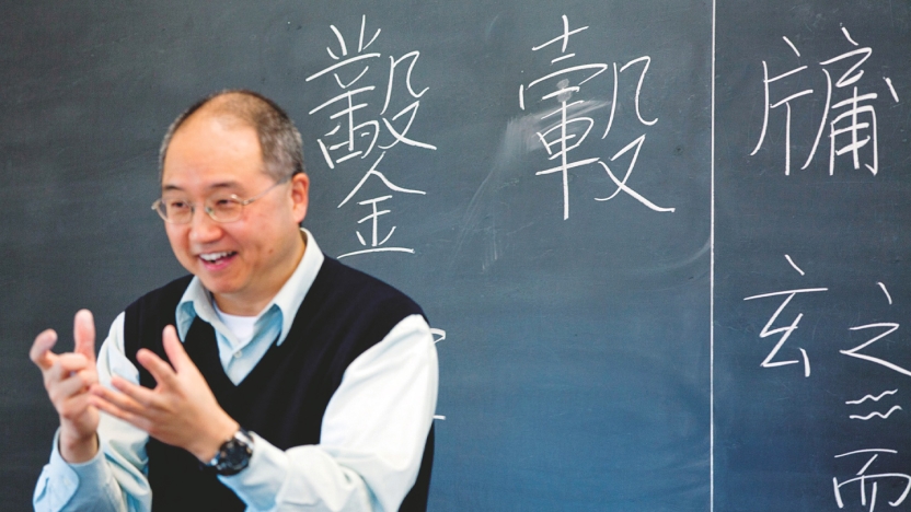 Teaching Chinese in front of a blackboard