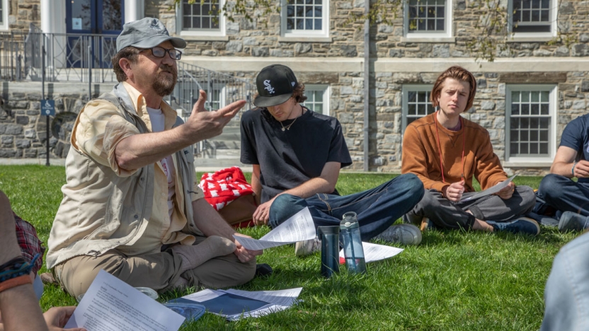 Professor Waldron teaches a class outside in spring.
