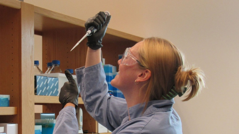 Researcher Lucy Ambach pipetting a sample