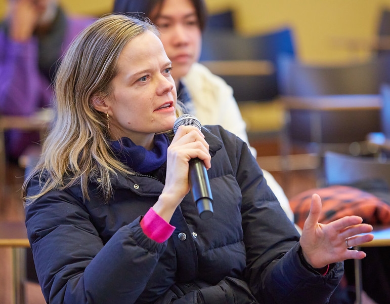 Prof. Maggie Clinton asking question at Dr. Jeremy Greene, MD, PhD, guest lecture