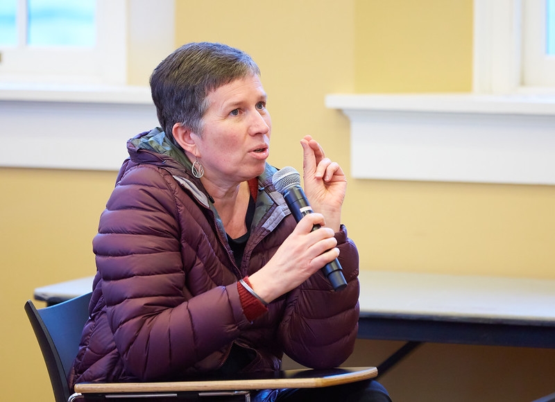 Prof. Marion Wells asking question at Dr. Jeremy Greene, MD, PhD, guest lecture