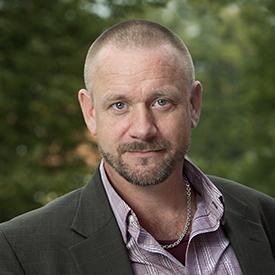 Image of a man wearing a collared shirt