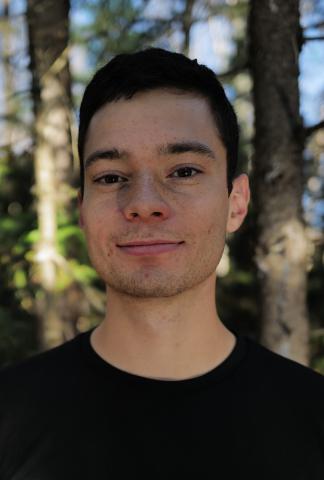 Image of a person wearing a black t-shirt