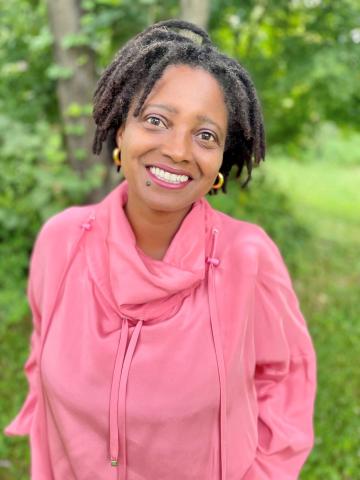 Image of a woman wearing a pink sweater