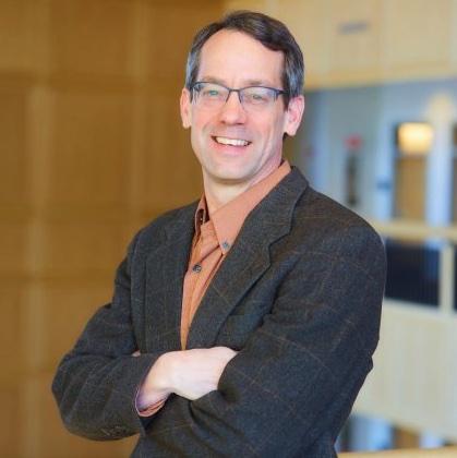 Man wearing glasses and smiling