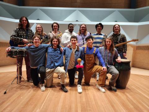 Image of musicians standing in a group