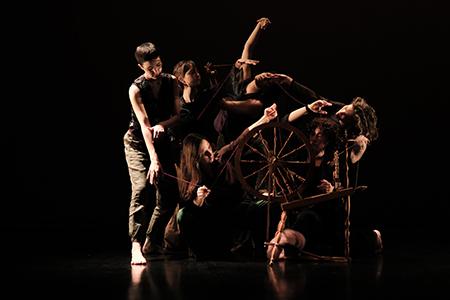 dancers against a black background