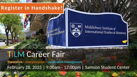 Student talking with employer Career Fair with blue pipe and drape background.