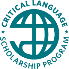 A teal logo of a globe displaying "Critical Language Scholarship Program" around the globe.