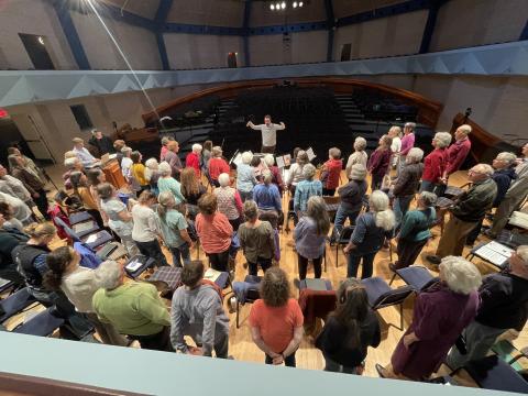 The Middlebury College Community Chorus rehearses in the Mahaney Arts Center Concert Hall.