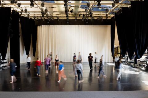 Dancers moving through space