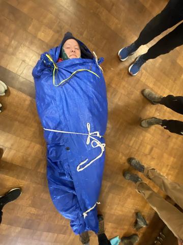 A student is thermo wrapped.