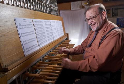 George Matthew seated at the carillon keyboard