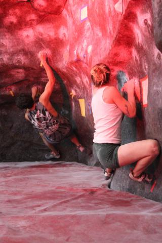 Two climbers climbing at the wall.
