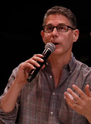 Person speaking into a microphone