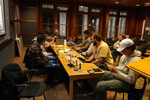 Collection of students at a fly tying workshop