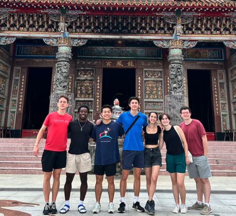 A photo of students standing in front of a temple in Taiwan.