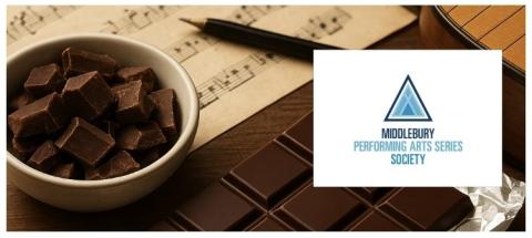A bowl of chocolate with sheet music in the background