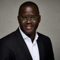 Nicholas Opiyo looking into camera