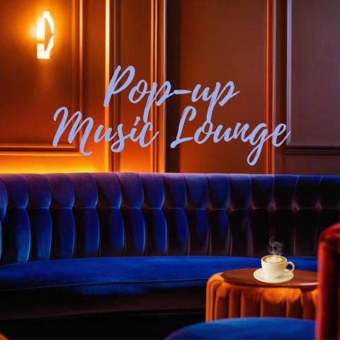 blue couch in lounge setting with cup of cocoa