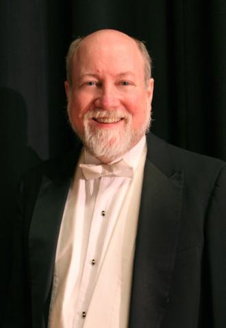 Image of a man in white tie