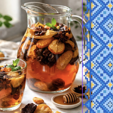 glass pitcher filled with a Ukraine hot beverage of dried fruits, spices, and honey.