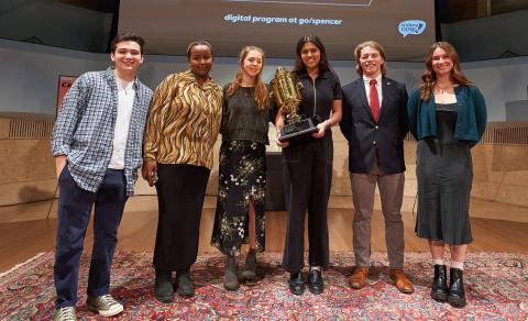 Six Spencer Prize finalists from 2023 standing on a stage