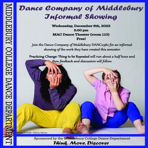 Two dancers in colorful clothing sitting on the floor