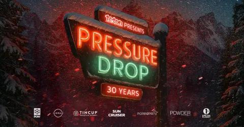 A red and green neon sign with a snowy backdrop that says "TGR Presents, Pressure Drop, 30 Years"
