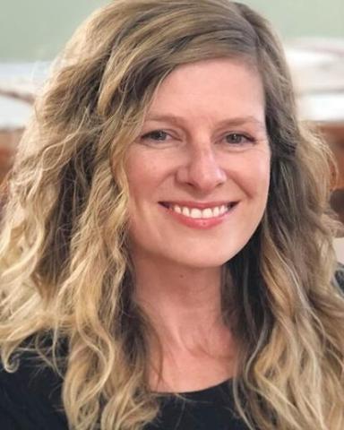 Woman smiling at the camera.