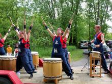 Musicians playing drums outdoors