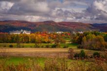 Autumnal landscape photograph of Middlebury College from a distance