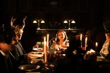 Image of people at a dining table wearing masks