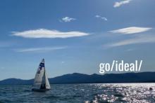 Sail boat on a lake with the words go/ideal
