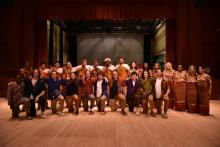 Image of musicians standing on a stage