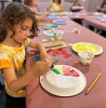 Child creating a color wheel.