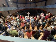 The Middlebury College Community Chorus rehearses in the Mahaney Arts Center Concert Hall.