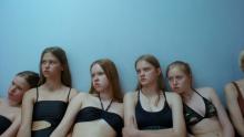 Several young women looking at something off-camera.